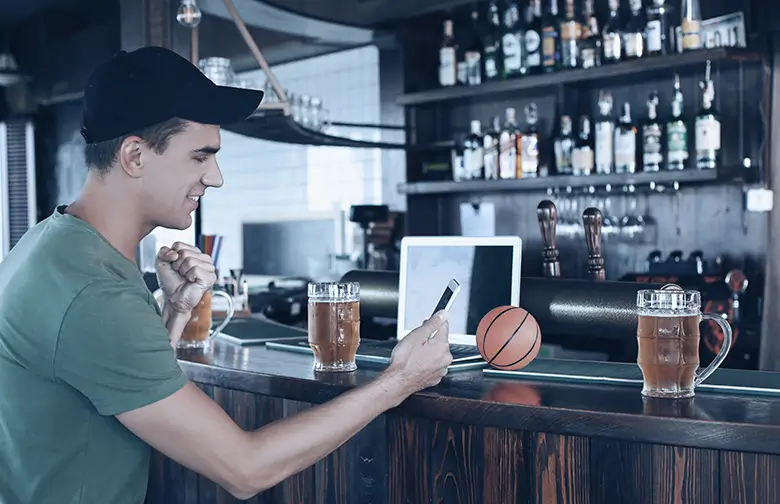 Professional reviewing real-time business data on mobile device, illustrating manufacturing ERP strategy and operational visibility